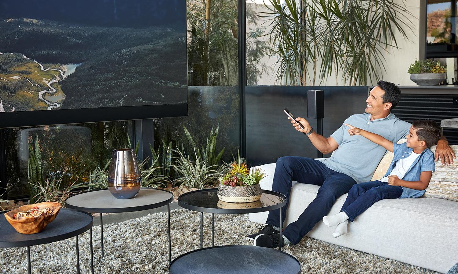 Man and child watching TV