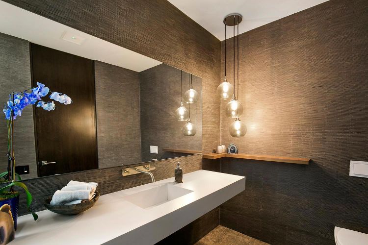 In ceiling Origin acoustics speakers in a modern dark bathroom
